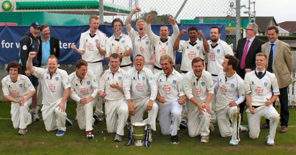 The winning team, pictured celebrating the Section One League victory.