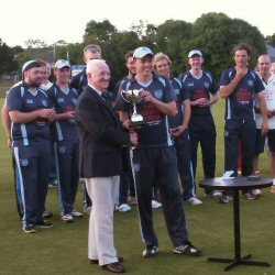 Carrick Cowboys skipper, Iain Parkhill receives trophy from NCU Preseident, Billy Boyd.
