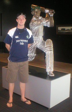 Andrew beside the Don Bradman statue at the MCG