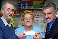 Maureen Moore receiving winning cheque...